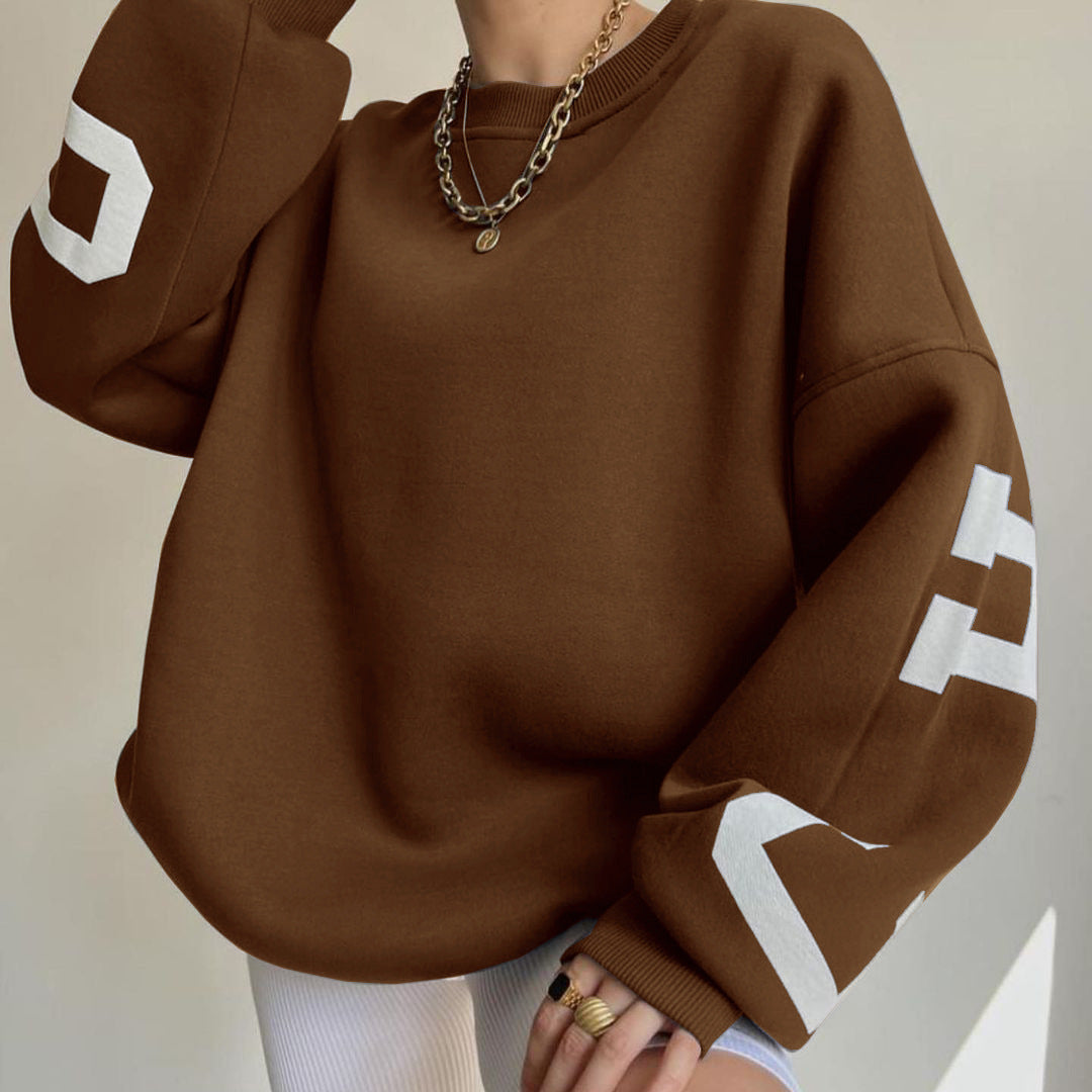 Women's top with print, round neckline, and long sleeves, loose fit