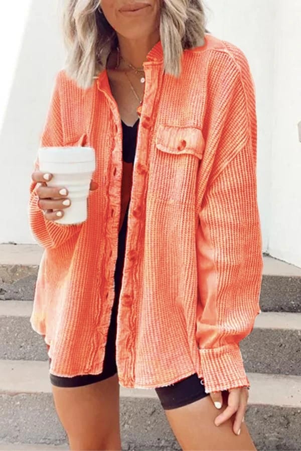 Women's shirt jacket with notch collar, front pockets, and asymmetrical hem