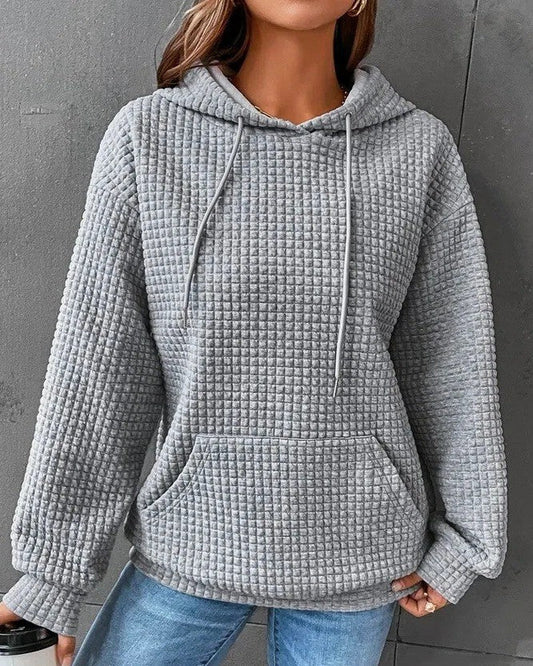Women's hooded sweater with long sleeves and solid color design