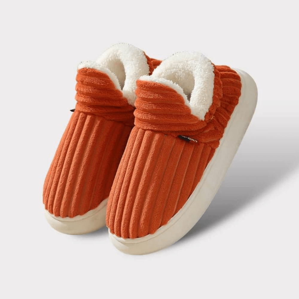 Orange Hausschuhe mit Plüschfutter, rutschfeste Sohle, warm und bequem, ideal für den Winter. Perfekte Pantoffeln für gemütliche Abende zu Hause.