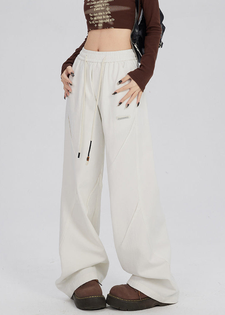 Women's trousers with wide legs and straight cut as well as mid-rise waistband