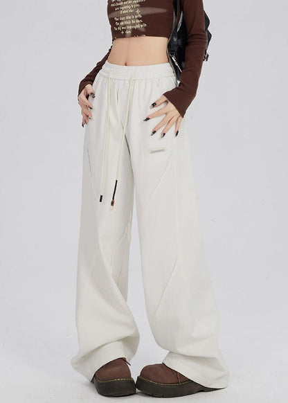 Women's trousers with wide legs and straight cut as well as mid-rise waistband