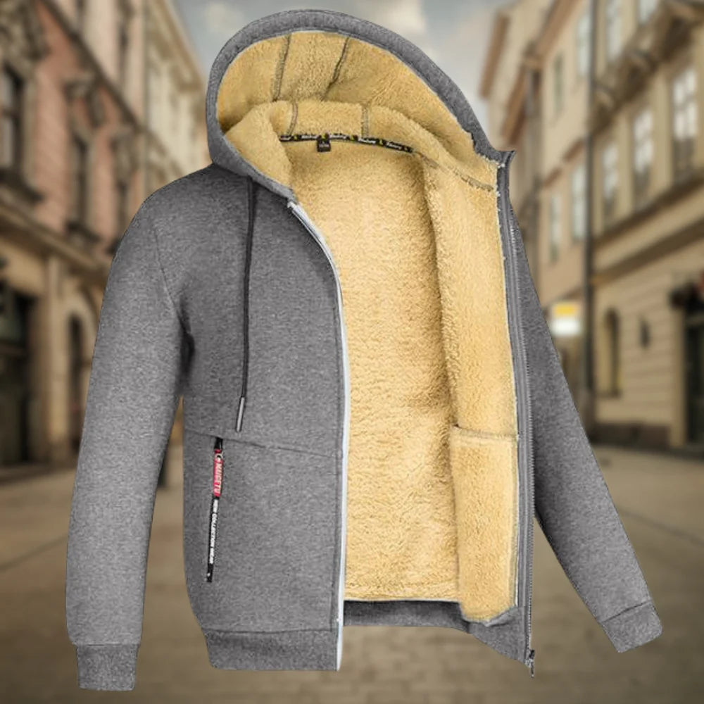 Graue Herren-Fleecejacke mit Kapuze und Reißverschluss, warm gefüttert, ideal für Herbst und Winter. Perfekt für urbane Outdoor-Aktivitäten.