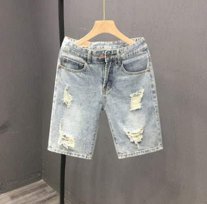 Men's denim shorts with a used look and rips, mid-rise waistband