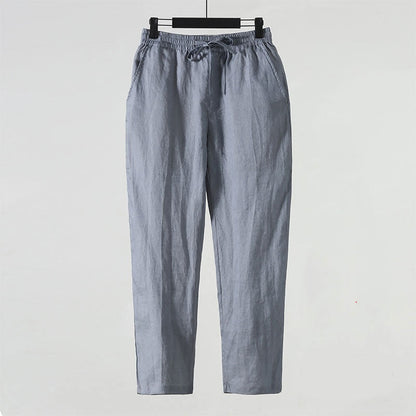 Graue Leinenhose mit elastischem Bund und Kordelzug, lässiger Stil, ideal für Sommermode, Herrenbekleidung, atmungsaktiv und bequem.