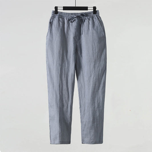 Graue Leinenhose mit elastischem Bund und Kordelzug, lässiger Stil, ideal für Sommermode, Herrenbekleidung, atmungsaktiv und bequem.
