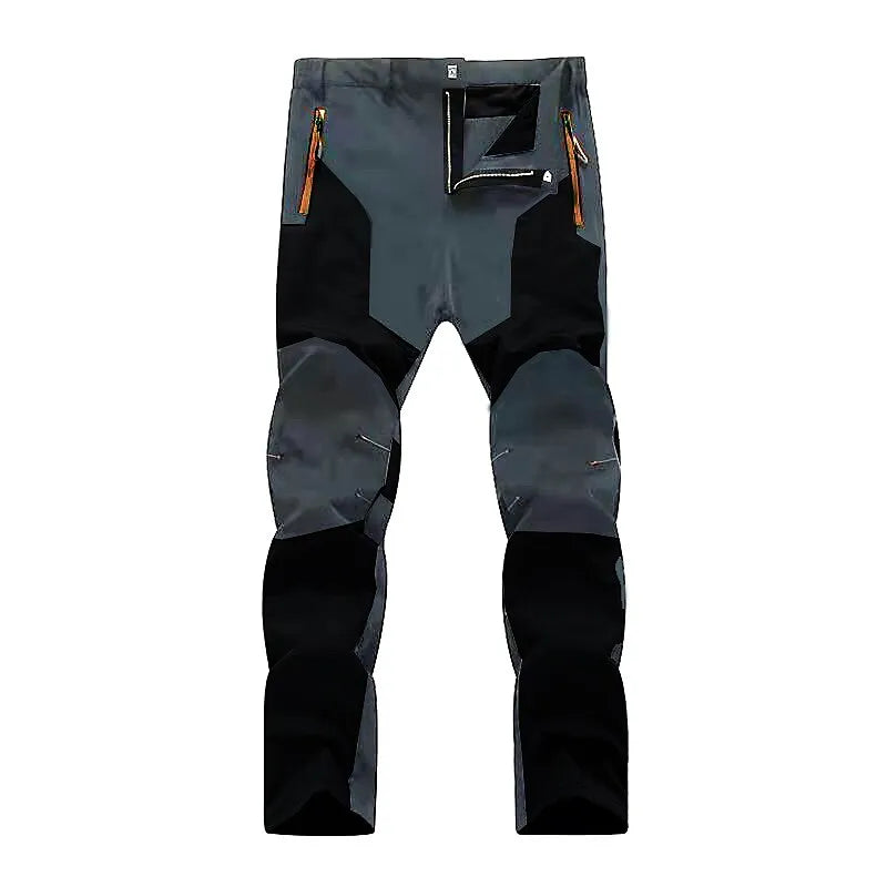 Graue und schwarze Outdoor-Hose mit Reißverschlusstaschen, strapazierfähigem Material, ideal für Wandern und Trekking. Robuste Trekkinghose Herren.