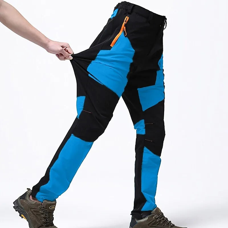 Schwarz-blaue Outdoor-Hose mit elastischem Bund und Reißverschlusstasche, ideal für Wandern und Trekking. Robuste, flexible Trekkinghose.