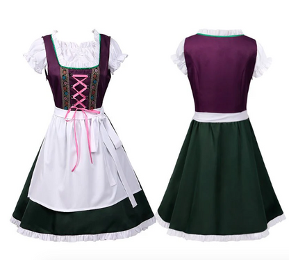 Traditionelles Dirndl-Kleid in Lila und Grün mit weißer Schürze, rosa Schnürung und Stickerei. Perfekt für Oktoberfest und Trachtenfeste.