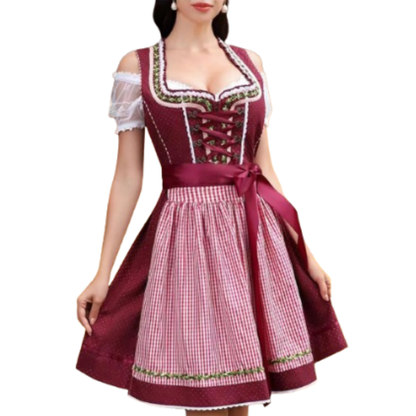 Frau in traditionellem bayerischen Dirndl mit rotem Mieder und kariertem Schürze, Oktoberfest Mode, Trachtenkleid, festliche Kleidung.