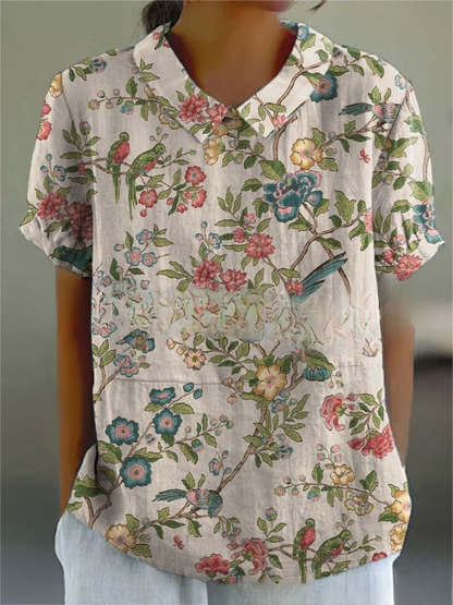 Damenbluse mit floralem Muster, Vögeln und Blumen, kurzärmelig, lässig, aus Baumwolle. Ideal für Sommermode und Freizeitkleidung.
