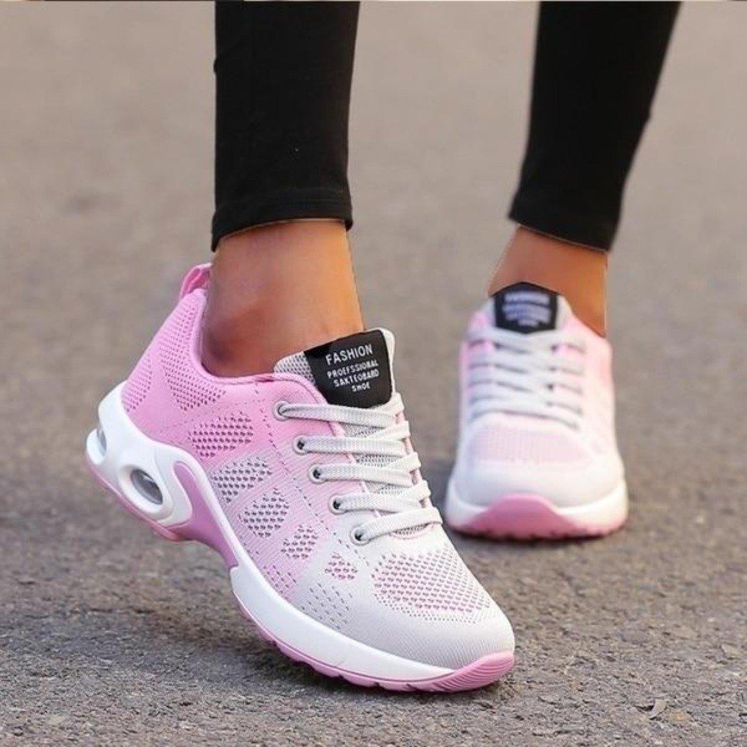 Damen Sneaker in Rosa und Weiß, atmungsaktiv, mit dicker Sohle und Schnürsenkeln, ideal für Laufen und Freizeitmode.