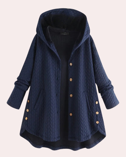 Dunkelblaue gesteppte Damenjacke mit Kapuze, Knopfleiste und Taschen. Modische Herbstjacke, ideal für kühle Tage. Bequeme und stilvolle Oberbekleidung.