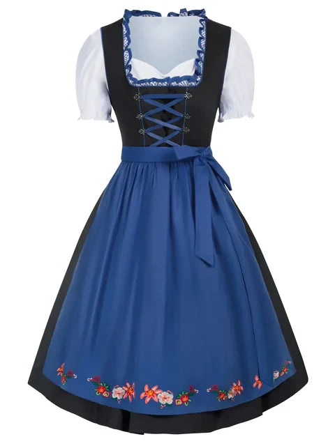 Blaues Dirndl mit schwarzem Mieder, weißer Bluse und floralen Stickereien am Saum. Traditionelle bayerische Tracht, ideal für Oktoberfest.