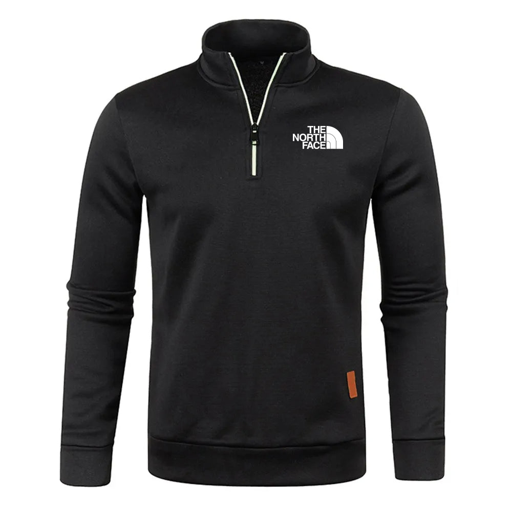 Schwarzer The North Face Pullover mit Reißverschluss, langärmelig, Logo auf der Brust, sportlich, modisch, ideal für Outdoor-Aktivitäten.