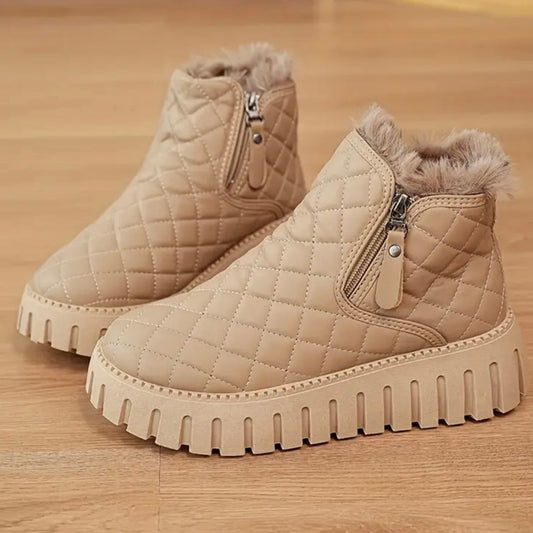 Women's winter boots with quilted upper material and side zipper