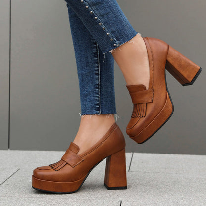 Women's platform shoes in loafer style slip-ons with block heel and front platform