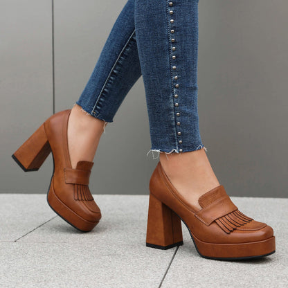 Women's platform shoes in loafer style slip-ons with block heel and front platform