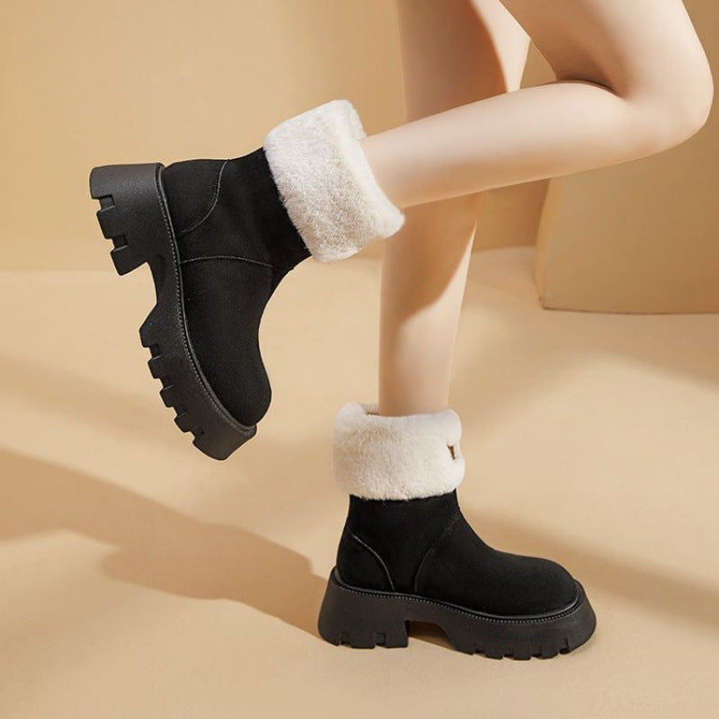 Schwarze Damen-Winterstiefel mit dicker Sohle und weißem Kunstfellfutter, modisch und warm, ideal für kalte Jahreszeiten.