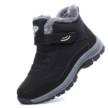Schwarzer Winterstiefel mit grauem Kunstfellfutter, Klettverschluss und rutschfester Sohle. Ideal für Outdoor-Aktivitäten bei kaltem Wetter.