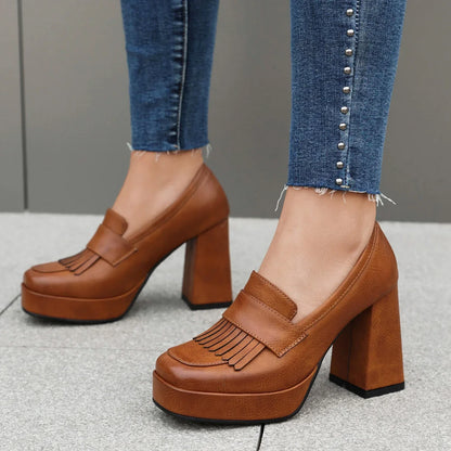 Women's platform shoes in loafer style slip-ons with block heel and front platform