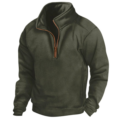 Dunkelgrüner Fleece-Pullover mit Reißverschluss, Stehkragen und langen Ärmeln. Ideal für Outdoor-Aktivitäten und kaltes Wetter.