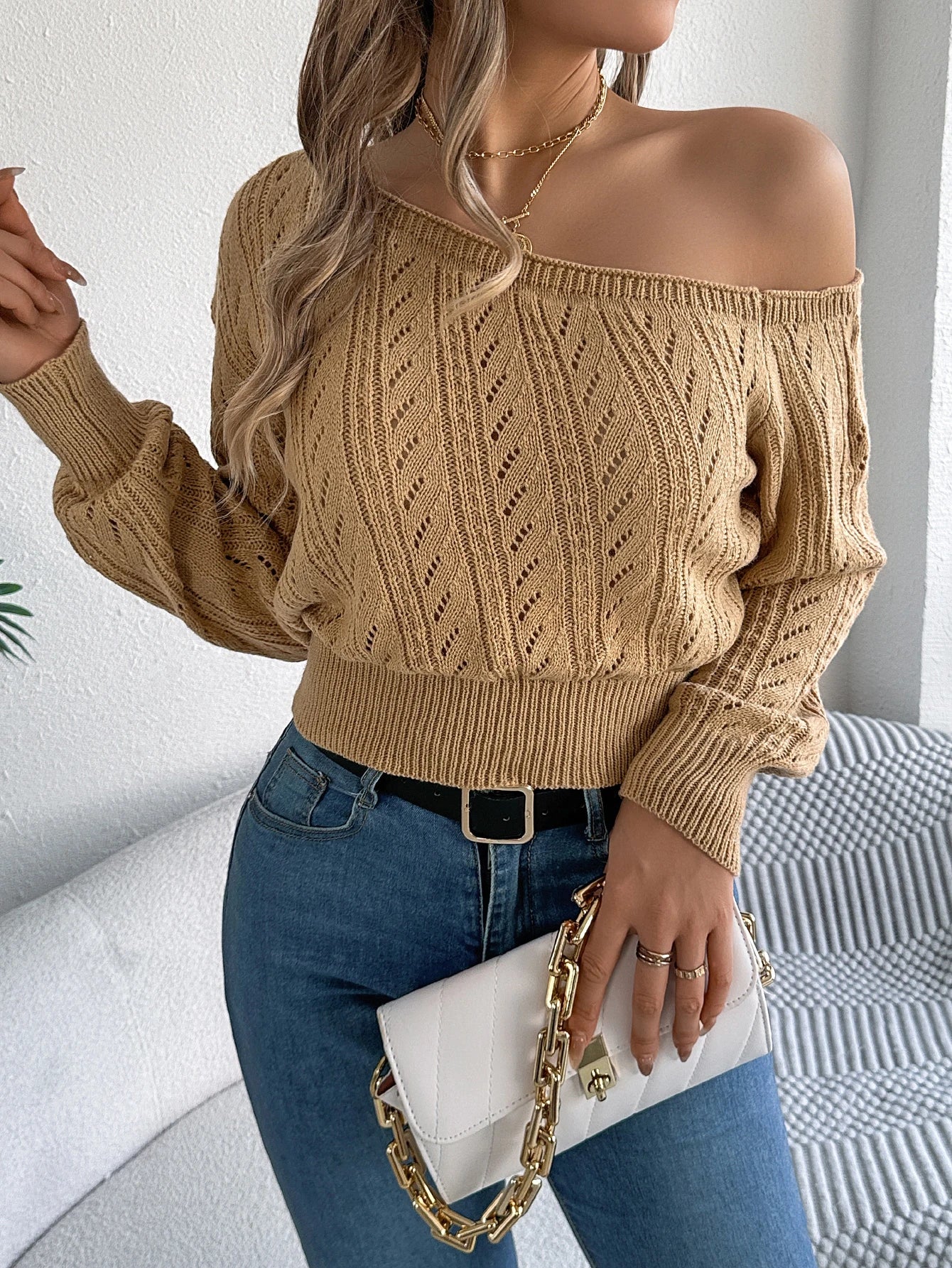 Women's autumn sweater with diagonal neckline and off-shoulder design