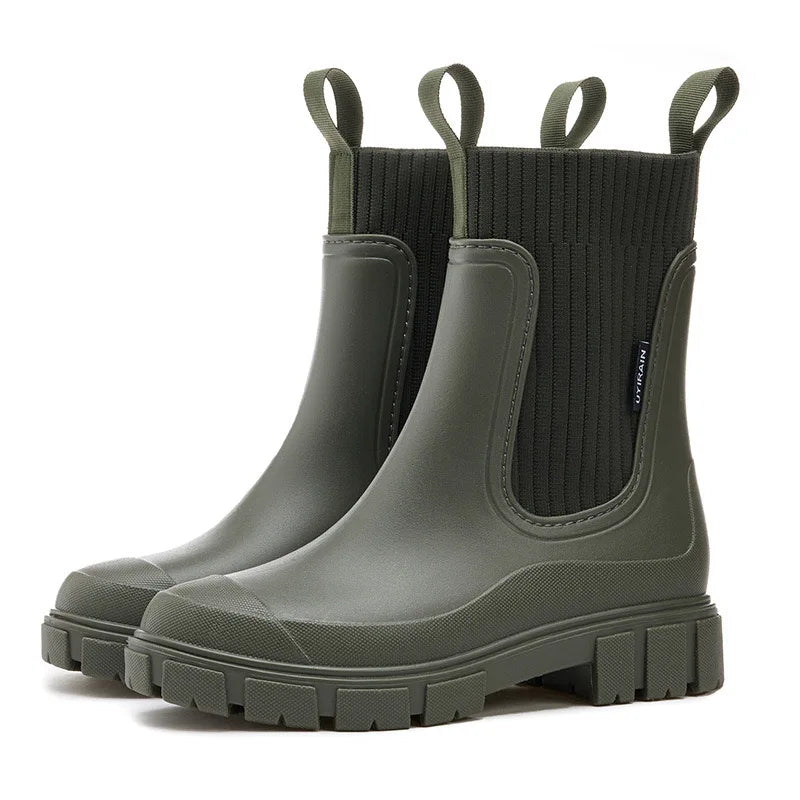 Grüne Gummistiefel mit dicker Sohle und Zuglaschen, ideal für Regenwetter. Modische, wasserdichte Stiefel für Damen und Herren.