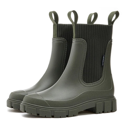 Grüne Gummistiefel mit dicker Sohle und Zuglaschen, ideal für Regenwetter. Modische, wasserdichte Stiefel für Damen und Herren.