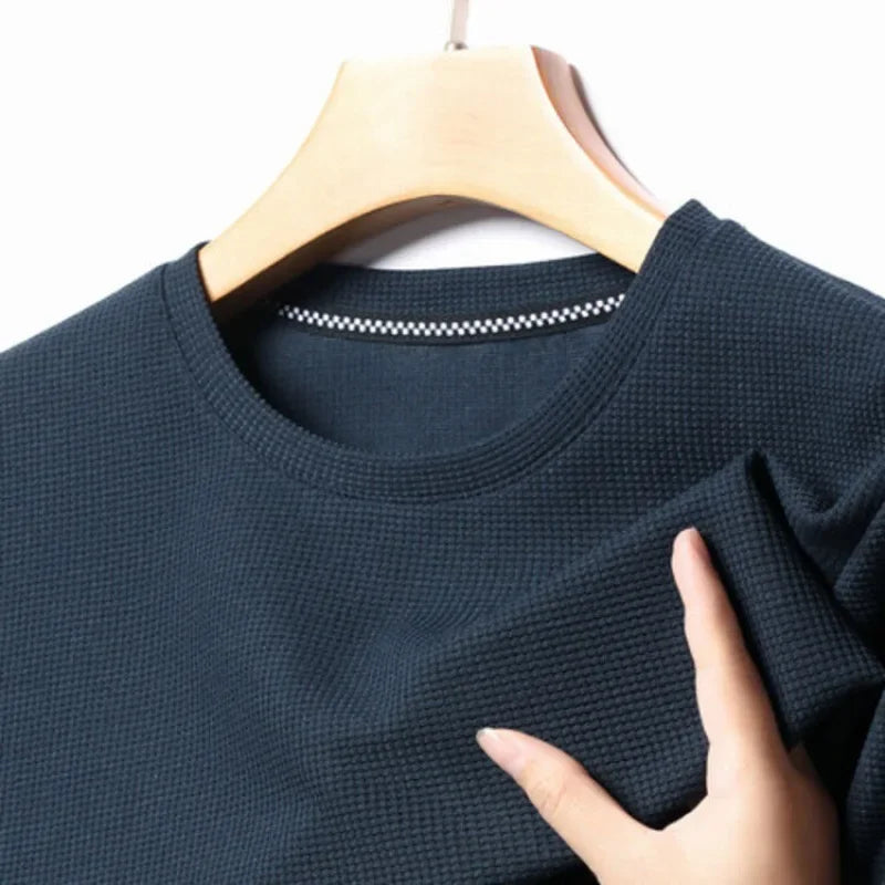 Men's shirt with round neck, waffle texture, and mesh fabric