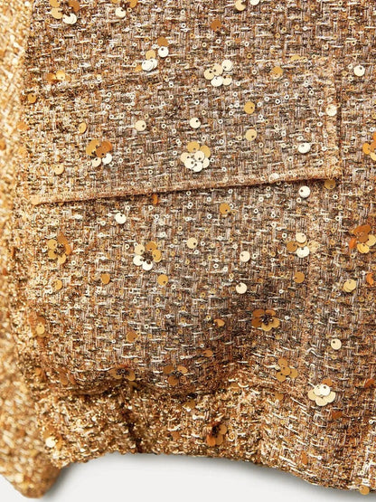 Goldene Paillettenjacke aus Tweed mit funkelnden Details, modisch und elegant, ideal für glamouröse Anlässe und stilvolle Outfits.