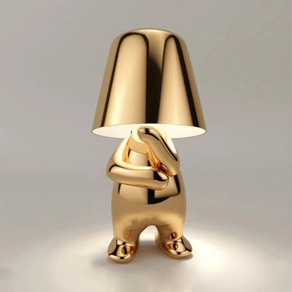Goldene Designer-Tischlampe in Hasenform, modernes Interieur, stilvolle Beleuchtung, einzigartiges Wohnaccessoire, luxuriöses Dekor, Kunstobjekt.