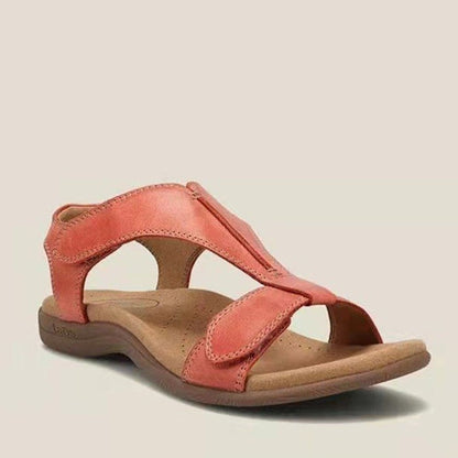Rote Damen-Sandale aus Leder mit ergonomischer Sohle, ideal für Sommermode und Komfort. Perfekt für Freizeit und Strand.