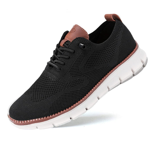 Schwarzer Herren-Sneaker mit weißer Sohle, atmungsaktivem Mesh-Obermaterial und braunen Akzenten. Bequeme Freizeitschuhe für Alltag und Sport.