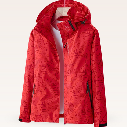 Rote Damen-Windjacke mit Kapuze, floralem Muster und Reißverschlusstaschen. Perfekt für Outdoor-Aktivitäten und modische Herbstkleidung.