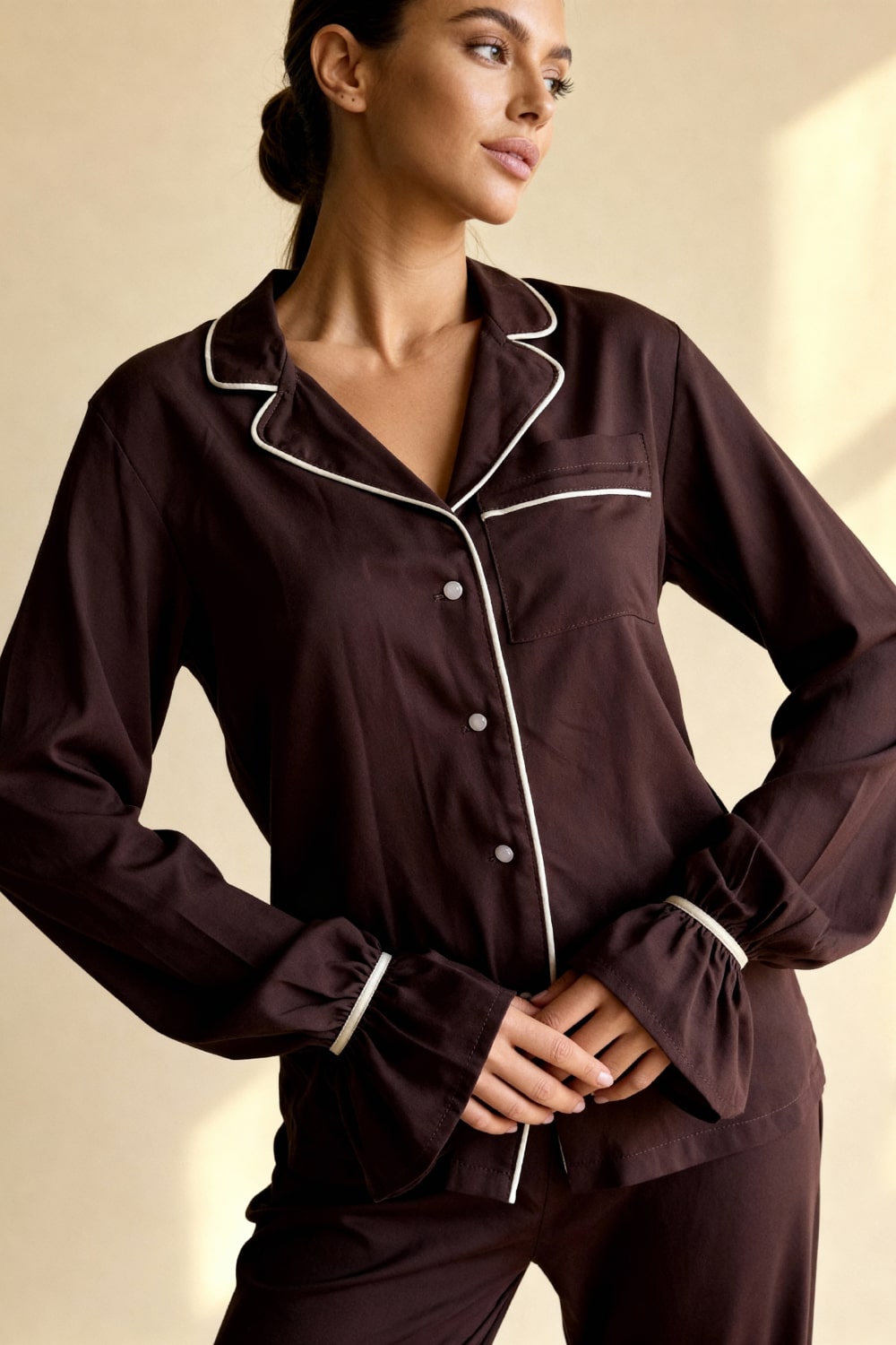 Women's pajama set with flowing top featuring a notched collar and flared sleeves