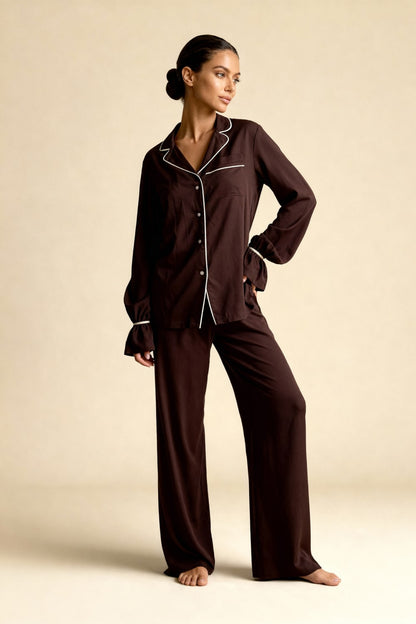 Women's pajama set with flowing top featuring a notched collar and flared sleeves