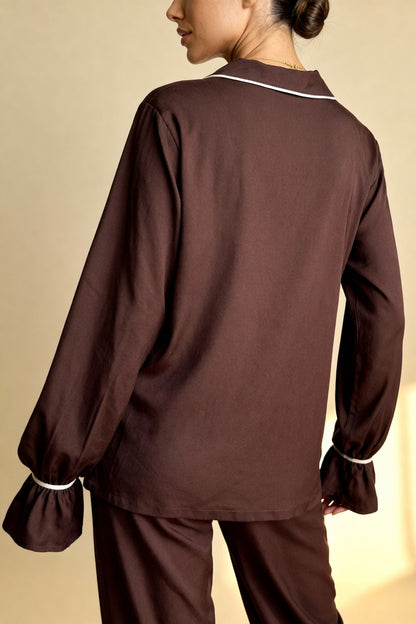 Women's pajama set with flowing top featuring a notched collar and flared sleeves
