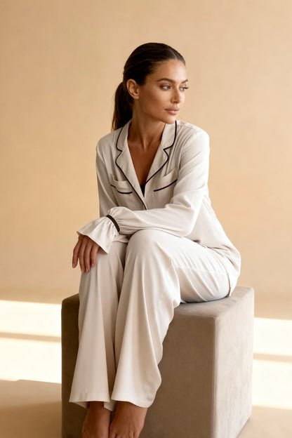 Women's pajama set with flowing top featuring a notched collar and flared sleeves