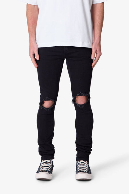 Herren Skinny Jeans Schwarzer Waschung Stretch-Denim mit Knie-Rissen und Verlängertem Beinabschluss