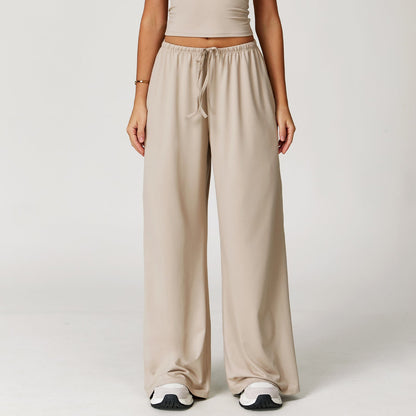 Wide women's pants made of brushed leather with high waist and pendant