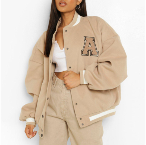 Women's winter jacket with fleece lining, quilting, embroidery, and button placket