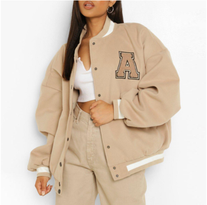 Women's winter jacket with fleece lining, quilting, embroidery, and button placket