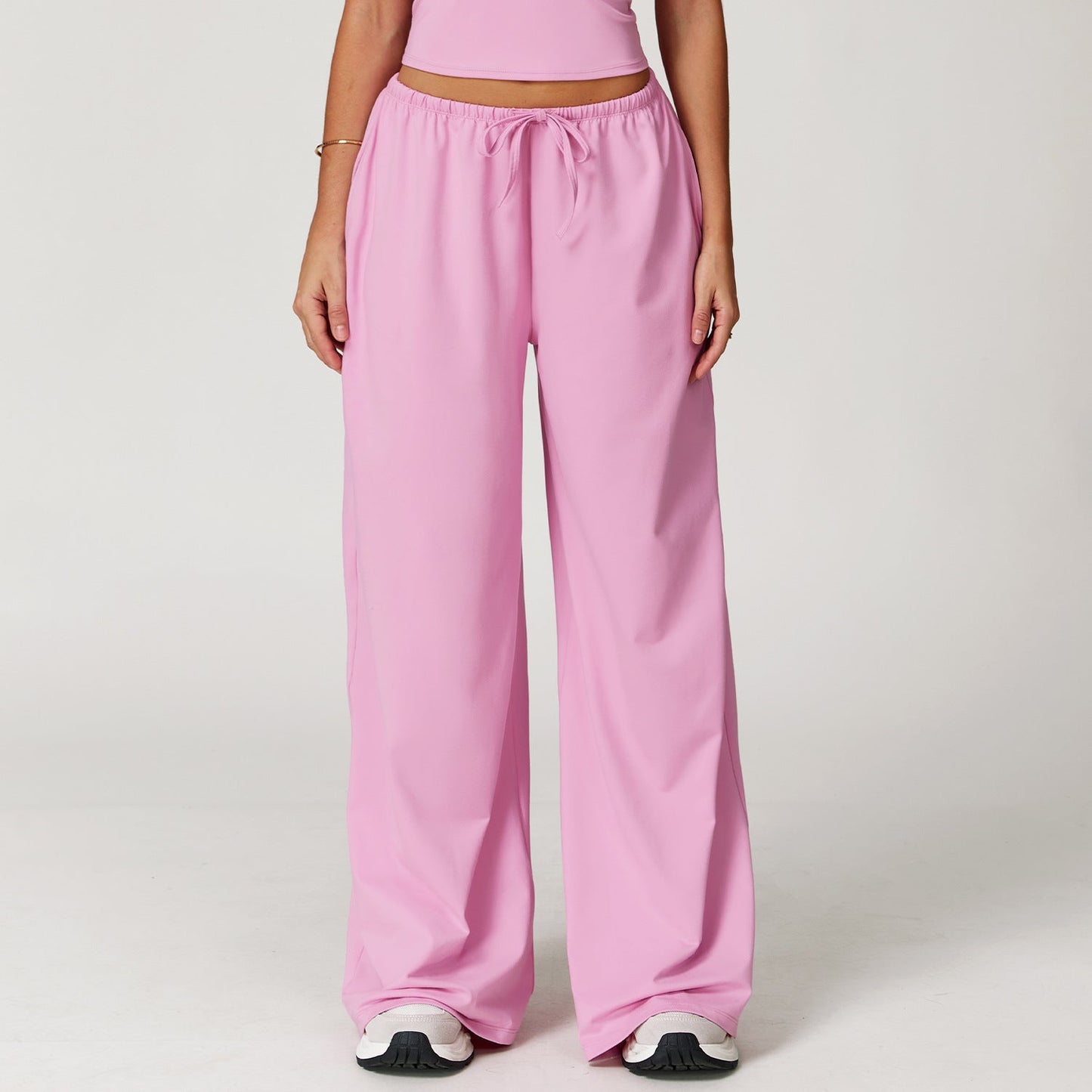 Wide women's pants made of brushed leather with high waist and pendant