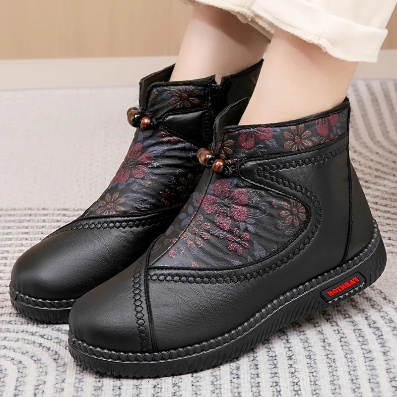 Women's ankle boots with floral embossing and side zipper
