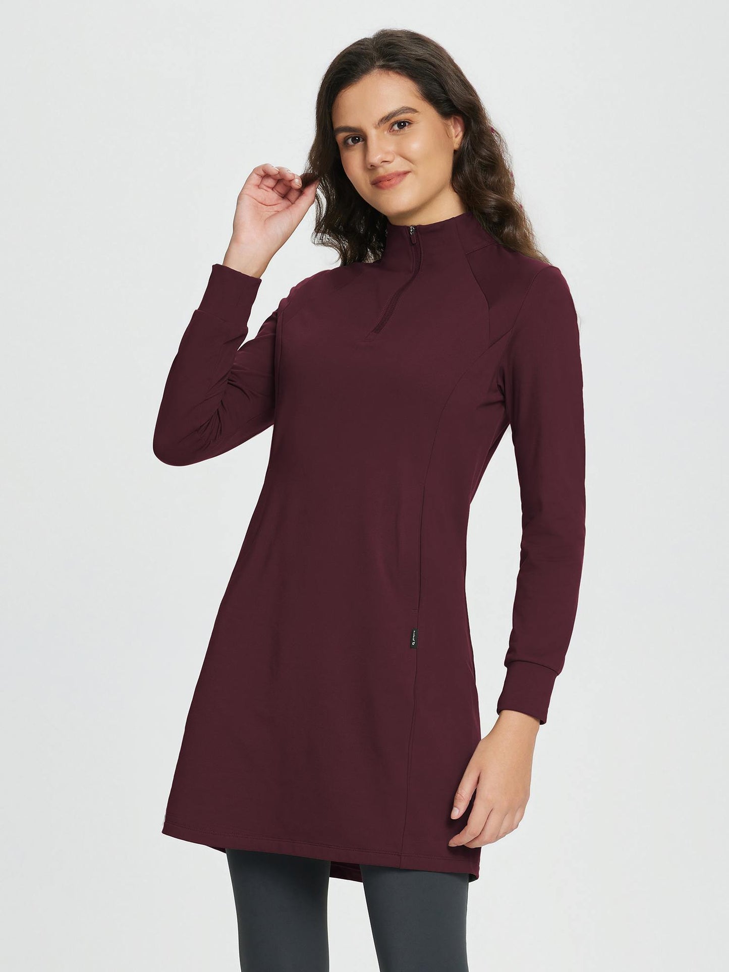 Women's winter dress with zipper stand-up collar, side pockets, and slitted hem