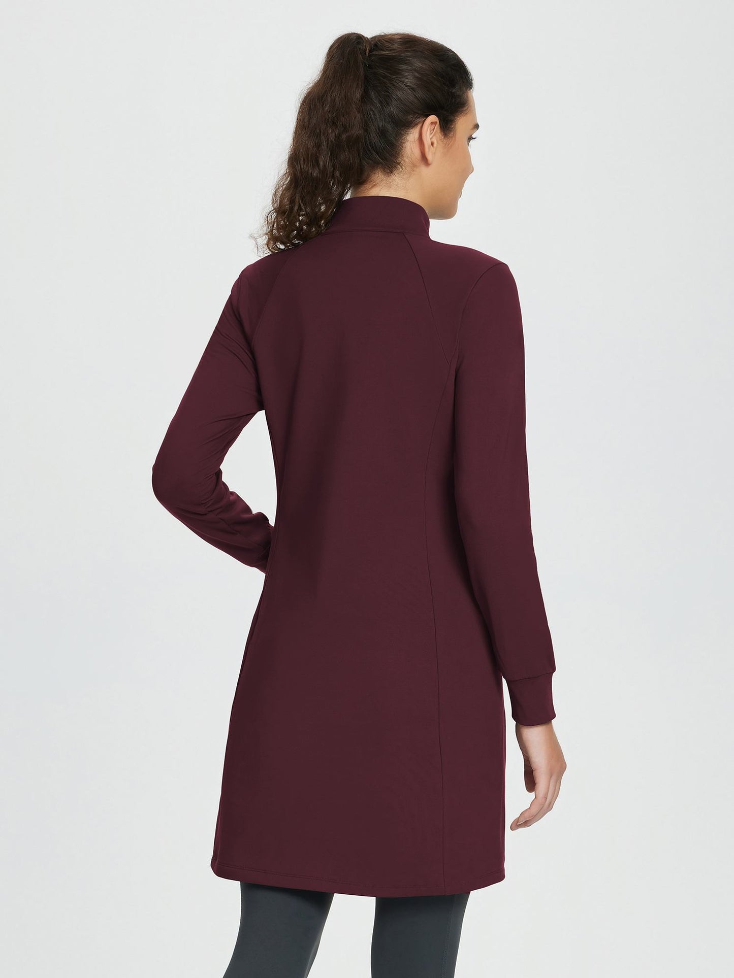 Women's winter dress with zipper stand-up collar, side pockets, and slitted hem