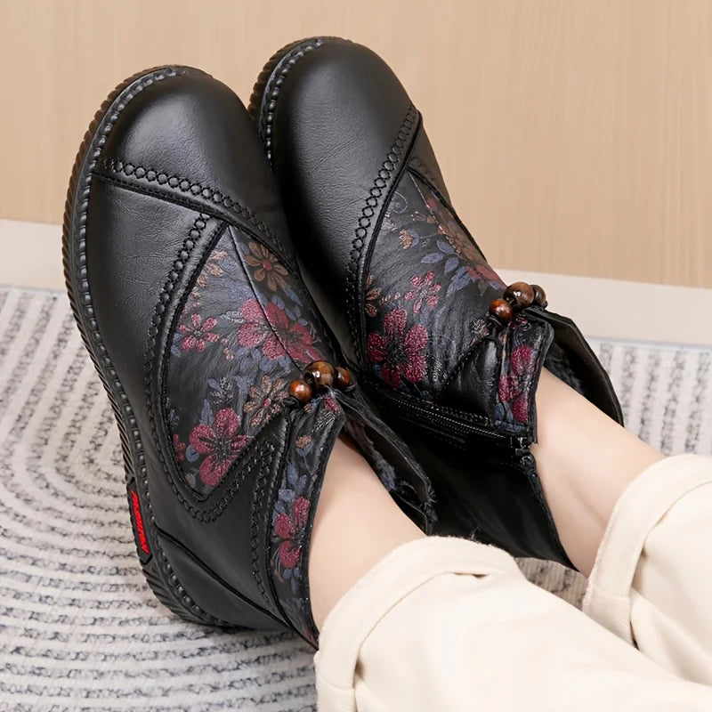 Women's ankle boots with floral embossing and side zipper