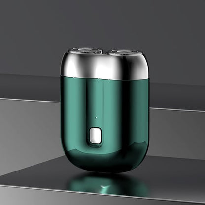 Grüner elektrischer Rasierer mit zwei rotierenden Köpfen auf grauem Hintergrund, modernes Design, tragbar, ideal für präzise Rasur.