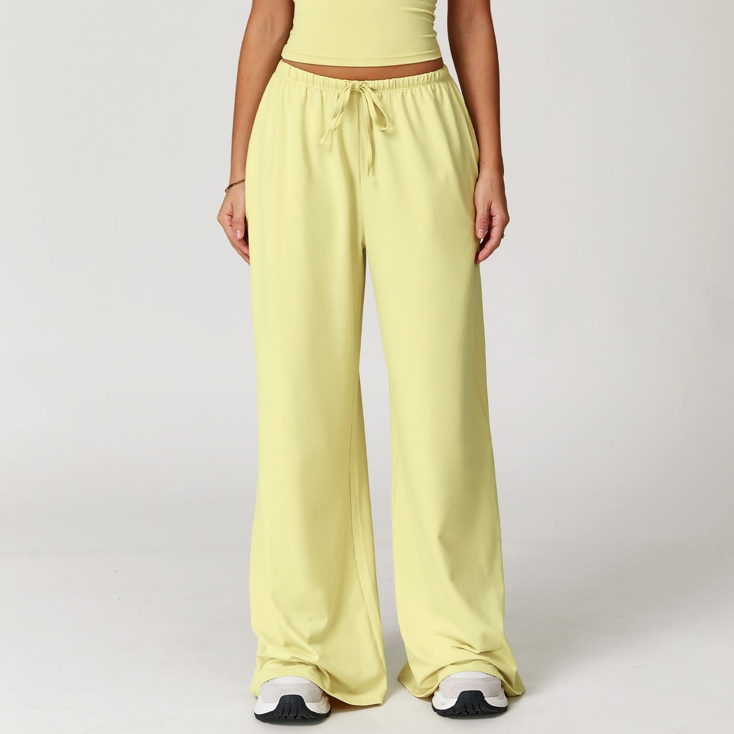 Wide women's pants made of brushed leather with high waist and pendant